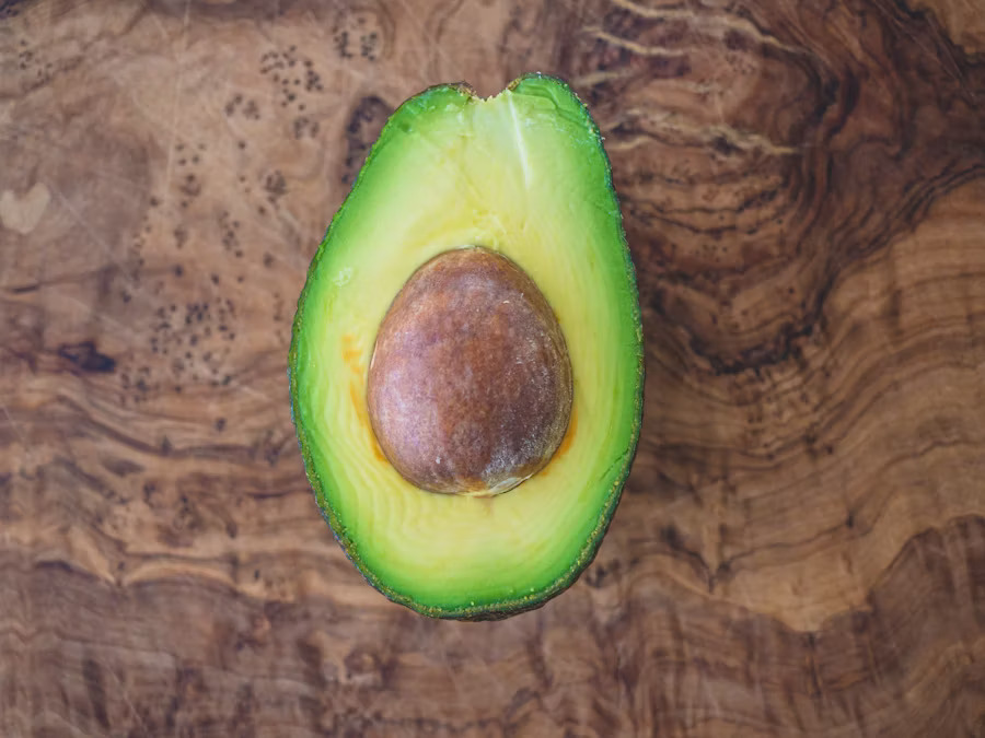 Avocado composited onto an AI-generated nature background scene