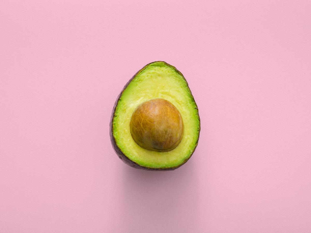 Avocado photo on a pink background Avocado photo on a pink background