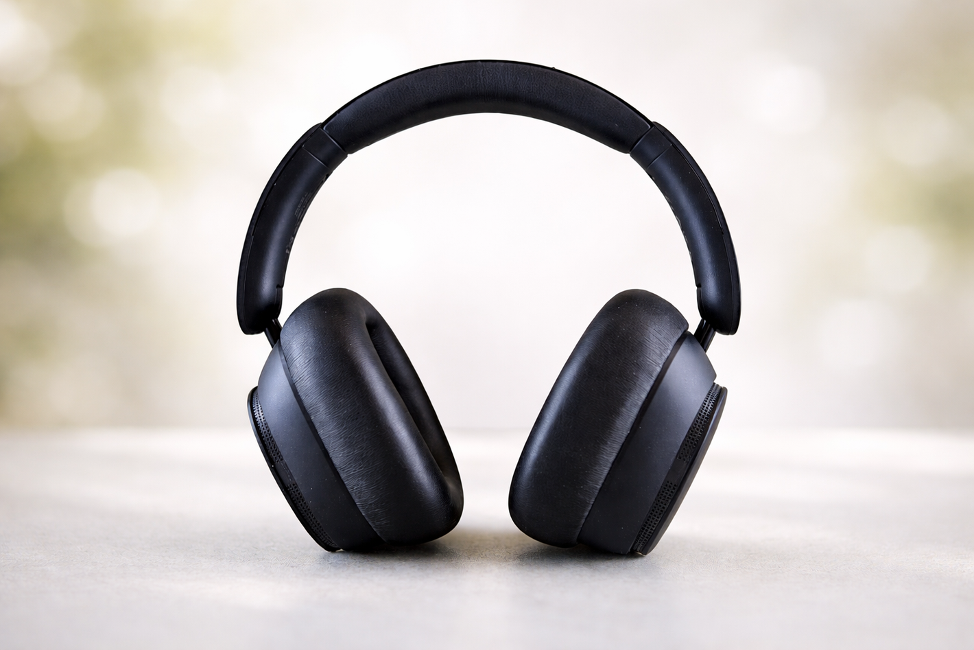 Black over-ear headphones with a softly blurred background after AI background blur, product kept in focus