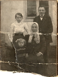 Old damaged family photo, try AI restoration