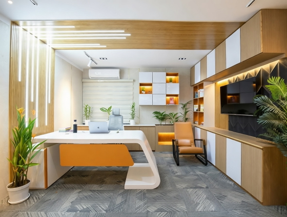 Original real-estate listing photo of a modern office with a white desk, orange chairs, houseplants, and electronics. Original real-estate listing photo of a modern office with a white desk, orange chairs, houseplants, and electronics.