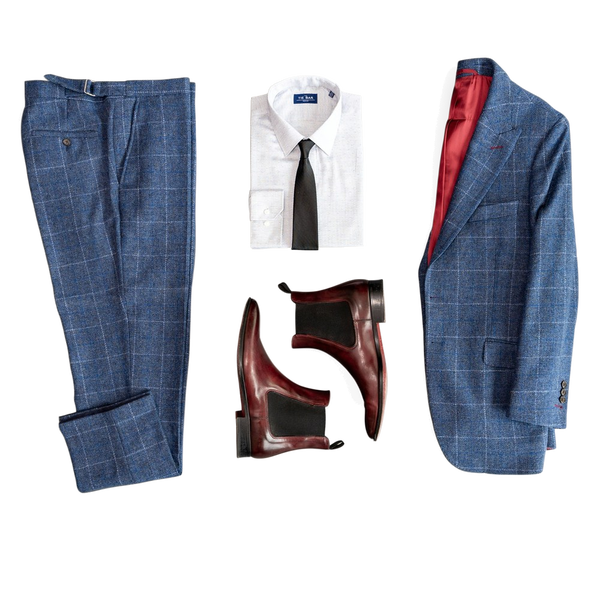 A blue checked suit laid out flat with a shirt, tie and boots — background removed by Remove.bg