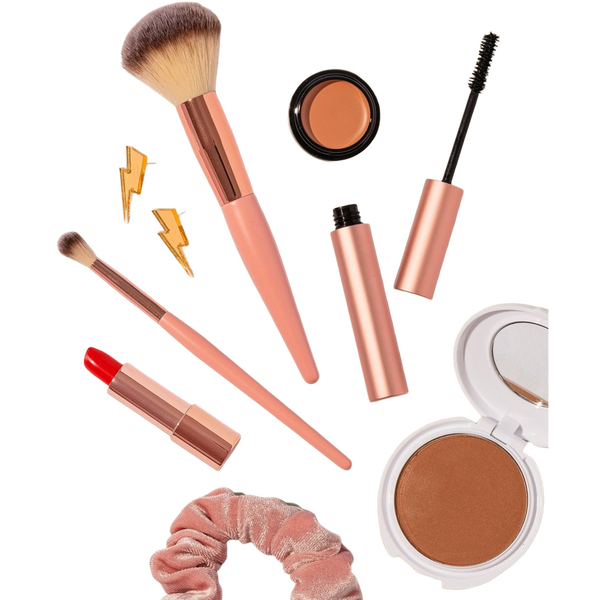 Make-up brushes, lipsticks and compacts on a beige background — background removed by iLoveIMG