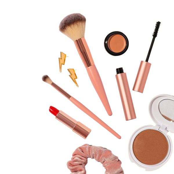 Make-up brushes, lipsticks and compacts on a beige background — background removed by GoStudio.ai (Free)