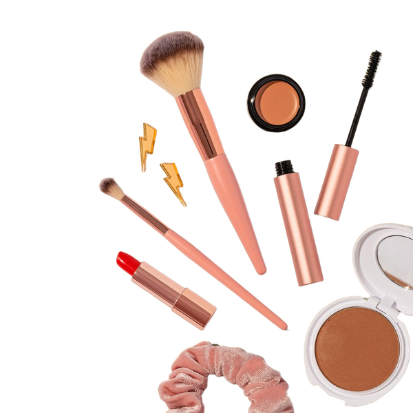 Make-up brushes, lipsticks and compacts on a beige background — background removed by Photoroom