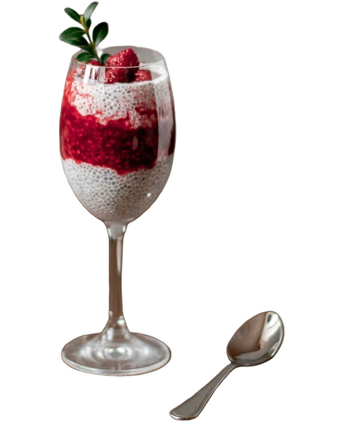 A berry parfait in a tall glass beside a spoon — background removed by iLoveIMG