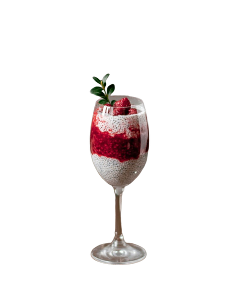 A berry parfait in a tall glass beside a spoon — background removed by Photoroom