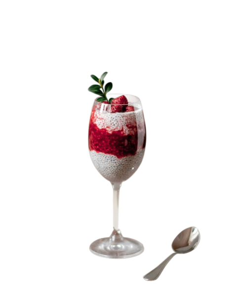 A berry parfait in a tall glass beside a spoon — background removed by Remove.bg