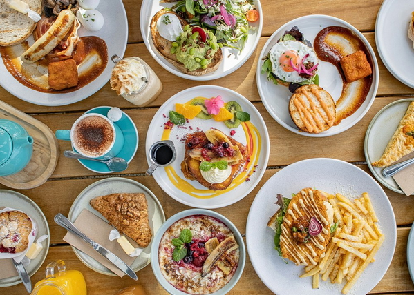 A table laid with brunch plates seen from above