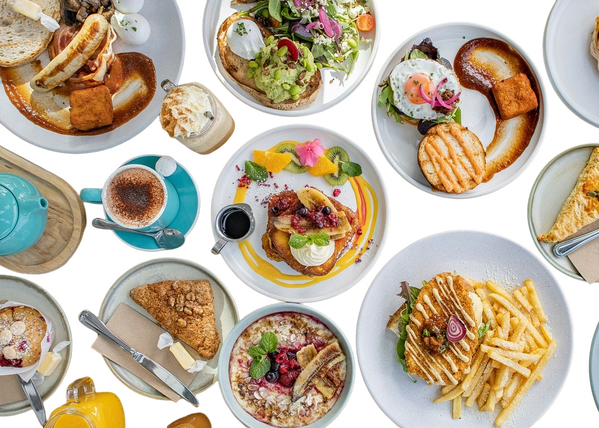 A table laid with brunch plates seen from above — background removed by iLoveIMG