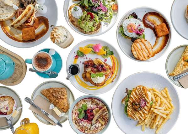 A table laid with brunch plates seen from above — background removed by Photoroom