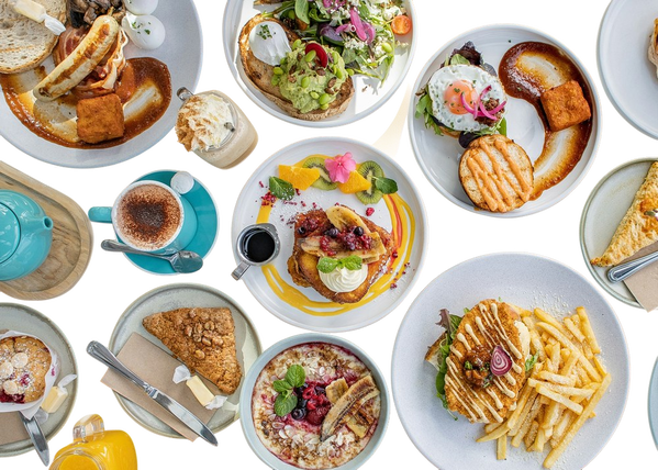 A table laid with brunch plates seen from above — background removed by Remove.bg