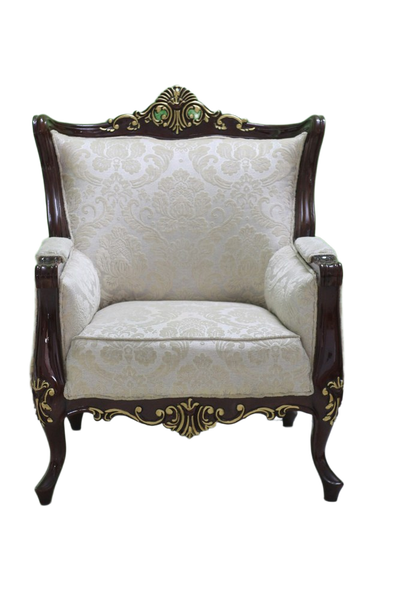 An ornate carved armchair against a green wall — background removed by Photoroom