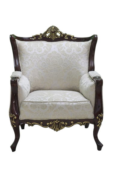 An ornate carved armchair against a green wall — background removed by Remove.bg