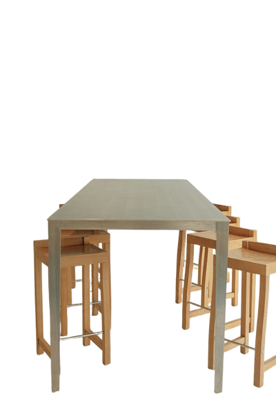 A pale dining table with stools tucked underneath — background removed by Photoroom