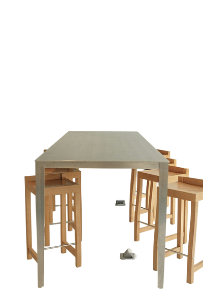A pale dining table with stools tucked underneath — background removed by Remove.bg