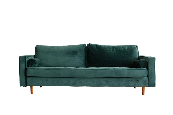 A green velvet sofa on a wooden floor — background removed by GoStudio.ai (Free)