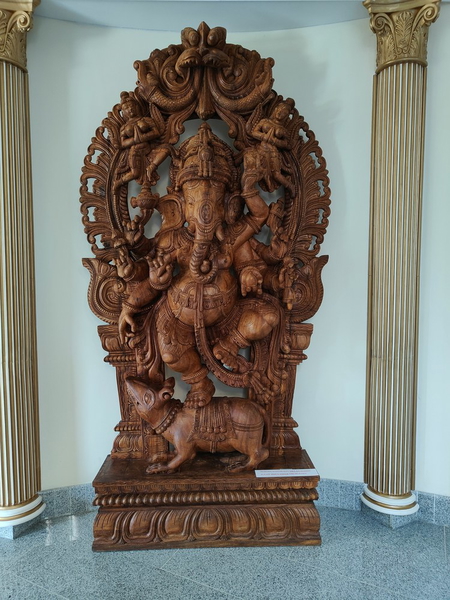 A carved wooden temple ornament