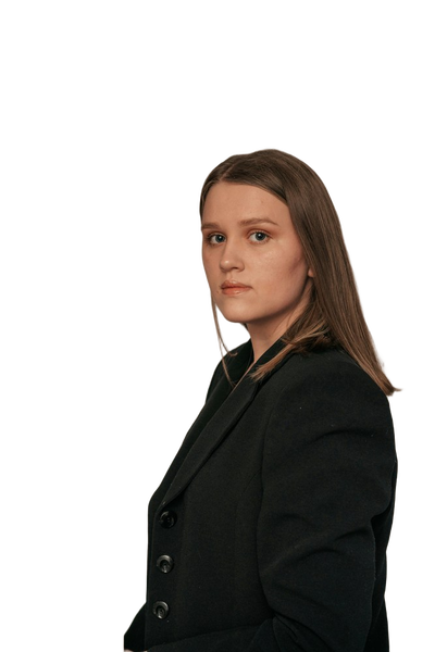 A woman in a dark blazer in front of dried pampas grass — background removed by Erase.bg