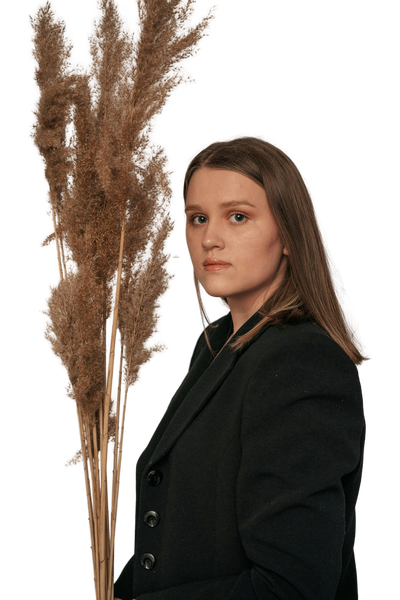 A woman in a dark blazer in front of dried pampas grass — background removed by GoStudio.ai (Free)