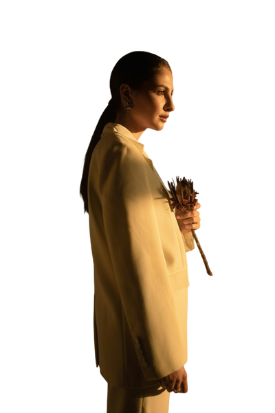 A woman in a yellow coat photographed in low light — background removed by GoStudio.ai (Free)
