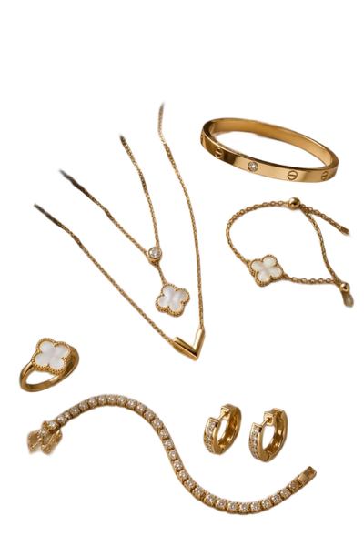 A flat-lay of gold necklaces, bangles, a ring and hoop earrings on beige satin — background removed by Erase.bg