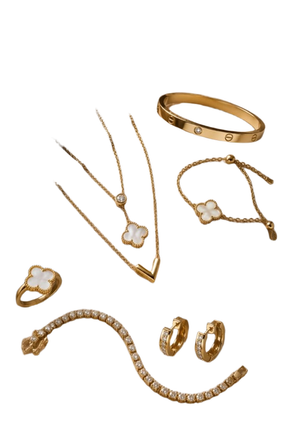 A flat-lay of gold necklaces, bangles, a ring and hoop earrings on beige satin — background removed by Photoroom