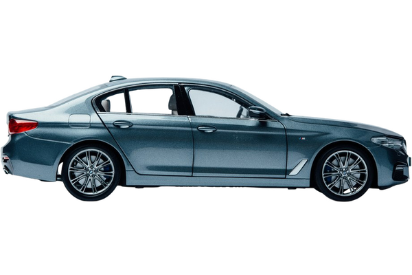 A dark blue saloon photographed in profile in a studio — background removed by iLoveIMG