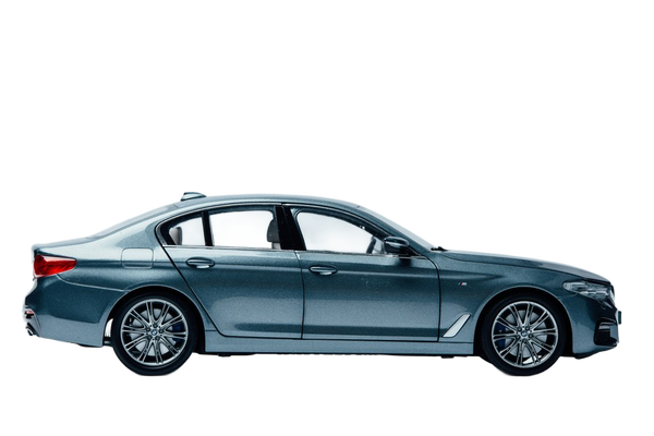 A dark blue saloon photographed in profile in a studio — background removed by Erase.bg