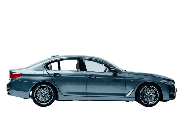 A dark blue saloon photographed in profile in a studio — background removed by GoStudio.ai (Free)