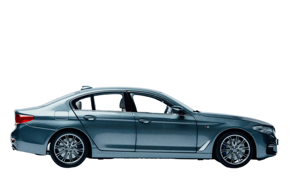 A dark blue saloon photographed in profile in a studio — background removed by Photoroom