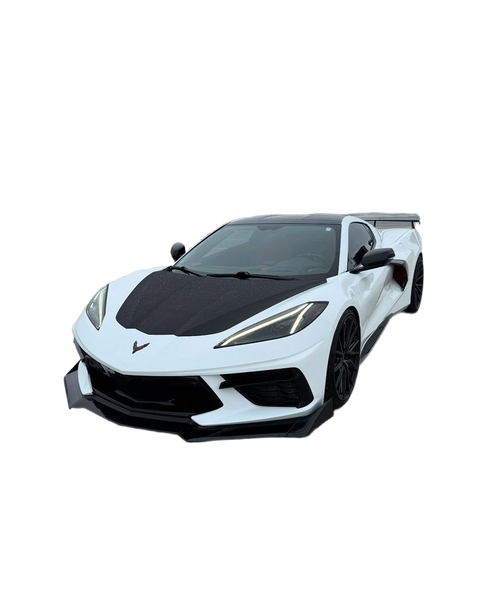 A white sports car with a carbon bonnet on a rooftop car park — background removed by Photoroom