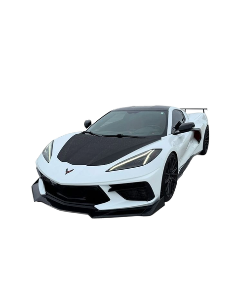 A white sports car with a carbon bonnet on a rooftop car park — background removed by Remove.bg