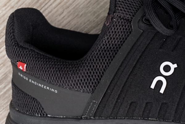 Close-up of a black mesh running shoe — upscaled by GoStudio Advanced