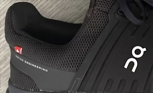 Close-up of a black mesh running shoe — upscaled by GoStudio Lite