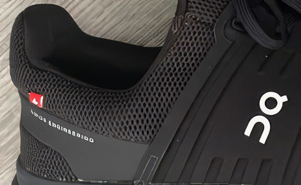 Close-up of a black mesh running shoe — upscaled by GoStudio Pro