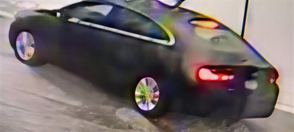 Dark sports car in motion, lit from the side — upscaled by GoStudio Pro