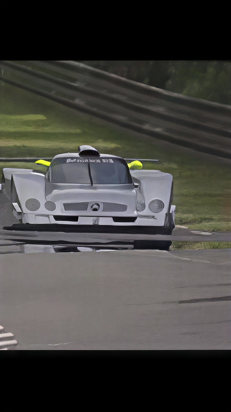 White racing prototype on a circuit, from a low angle — upscaled by GoStudio Pro