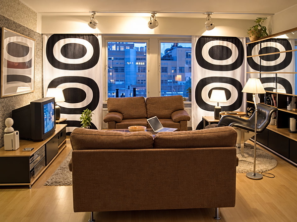 Living room with brown leather sofas and bold black-and-white patterned walls — upscaled by GPT Image 2.5