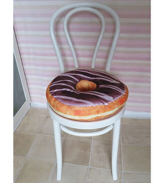 White bentwood chair with a doughnut-shaped cushion against a striped wall — upscaled by GoStudio Lite