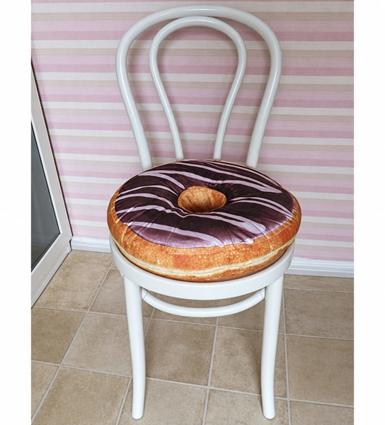 White bentwood chair with a doughnut-shaped cushion against a striped wall — upscaled by GPT Image 2.5