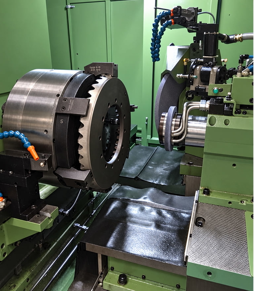 CNC lathe with a chuck and tooling, in a green machine enclosure — upscaled by GPT Image 2.5