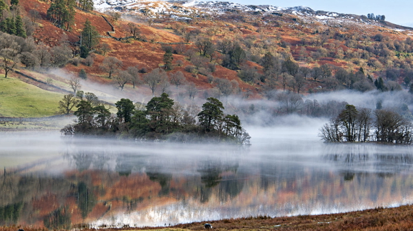 Mist over a lake with autumn hillside behind, at 1920×1080 — upscaled by GPT Image 2.5