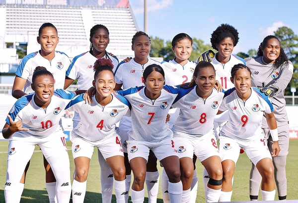 Women’s football team in white kit posing for a team photo in a stadium — watermark removed by GoStudio Advanced