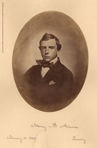 Oval sepia portrait of a young man in a bow tie, with a handwritten name, date and place below — watermark removed by GoStudio Advanced