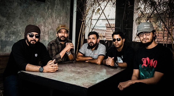 Five men seated around a stone table — watermark removed by GoStudio Lite