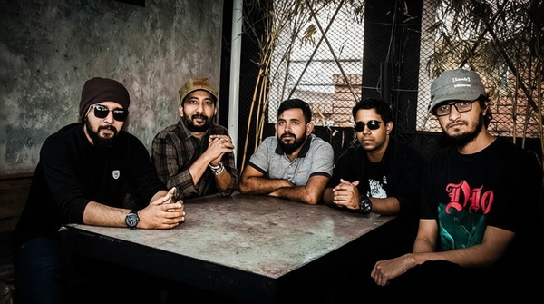 Five men seated around a stone table — watermark removed by GoStudio Pro
