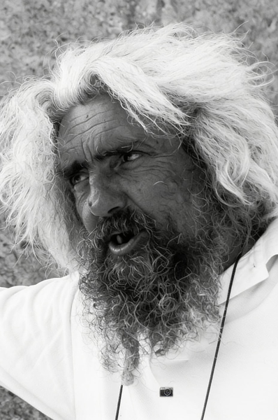 Black-and-white portrait of a man with wild white hair and a long beard — watermark removed by GoStudio Advanced