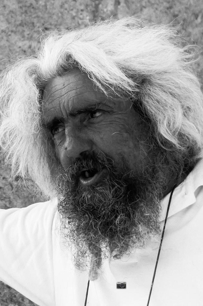 Black-and-white portrait of a man with wild white hair and a long beard — watermark removed by GoStudio Lite