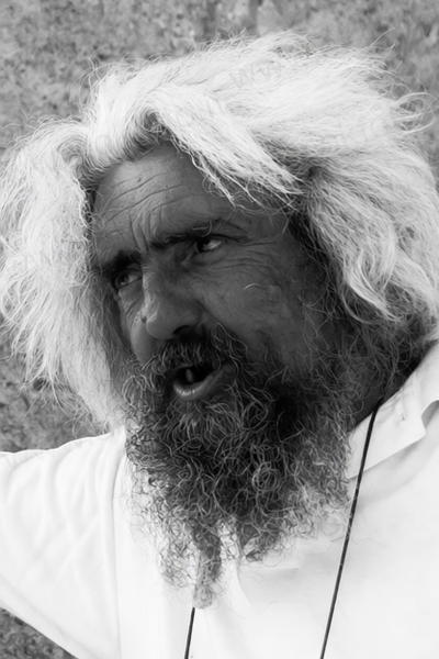 Black-and-white portrait of a man with wild white hair and a long beard — watermark removed by GoStudio Pro